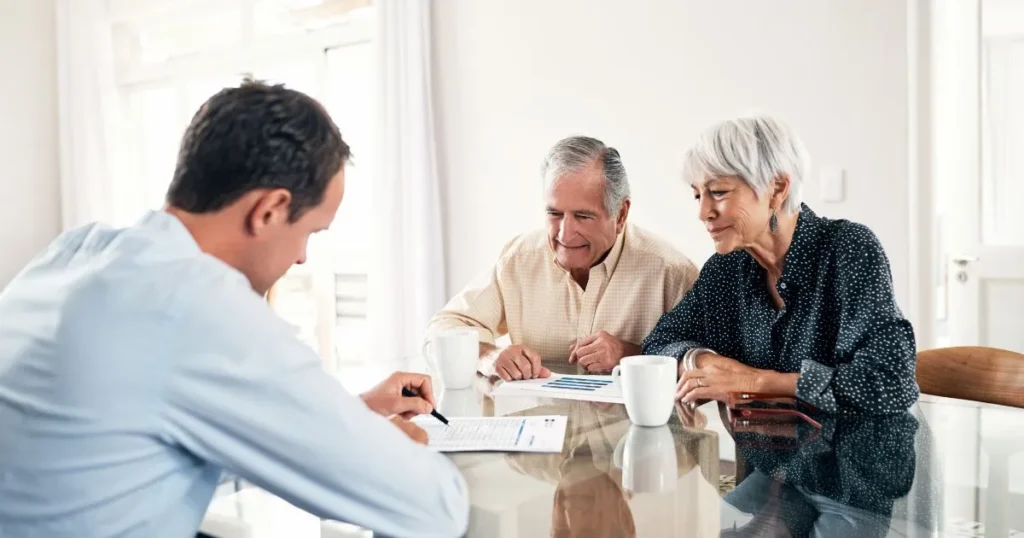 Retired married couple consulting with an attorney
