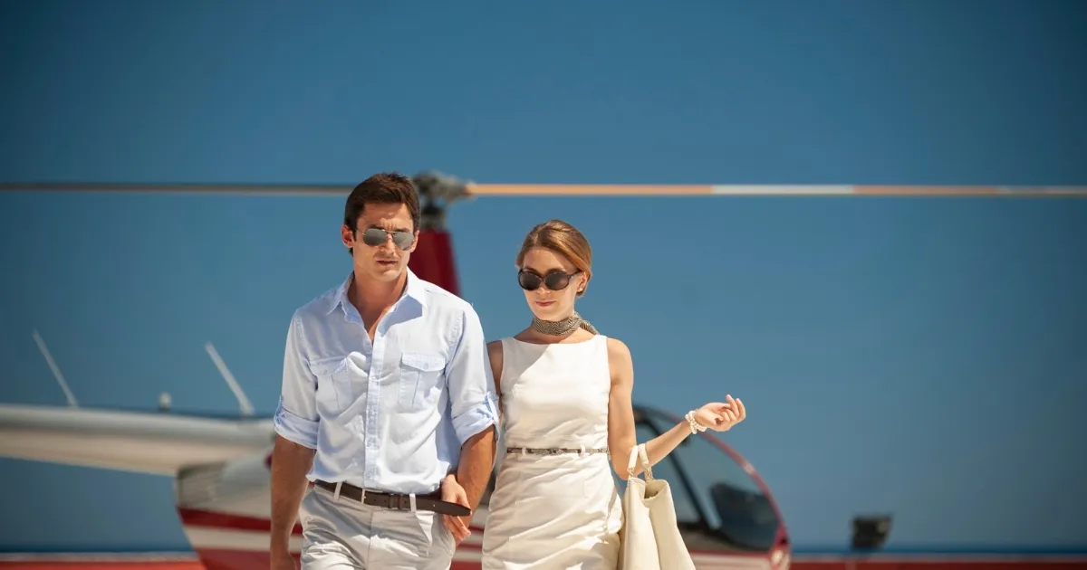 Wealthy couple getting off their helicopter and filing for a high asset divorce