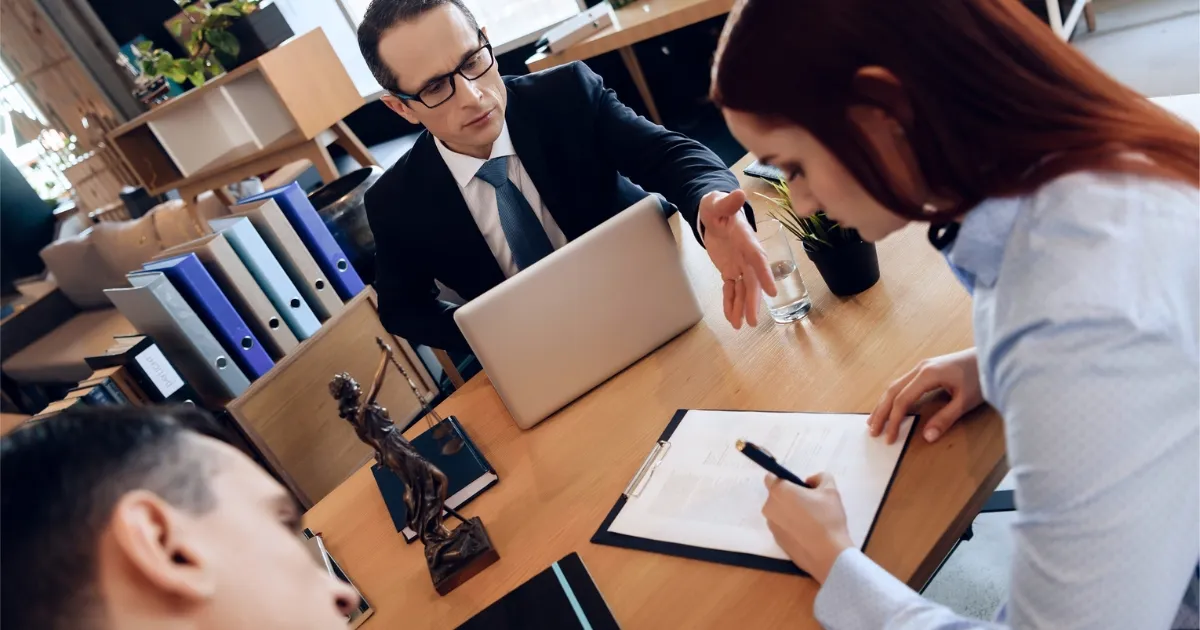 Couple signing General Indignities Divorce Arkansas papers